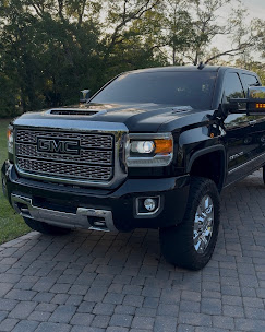 Freshly detailed black GMC Denali truck